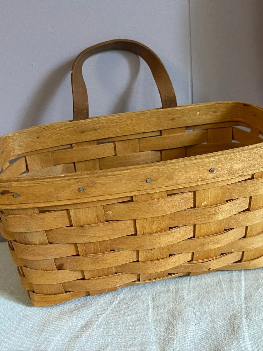 Longaberger woven basket in warm tan